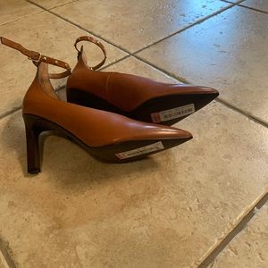 Multiple pairs of shoes.